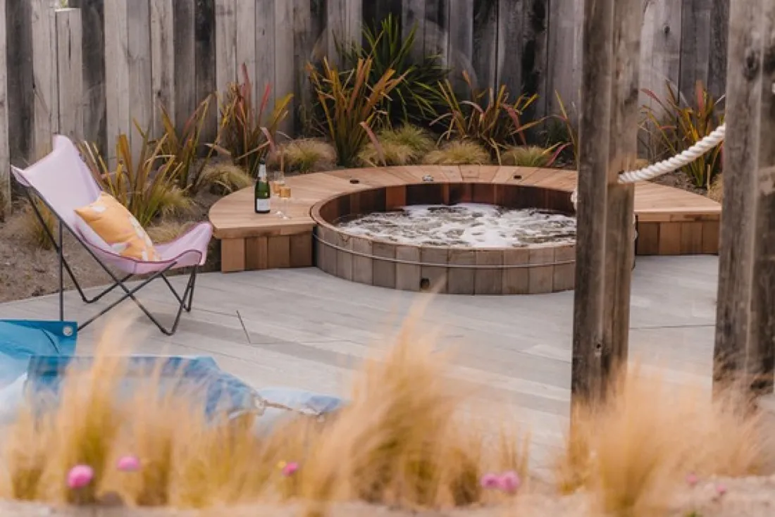 Private hot tub on a beach house deck among the dune grasses