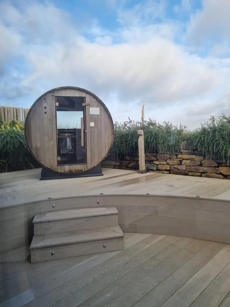 Barrel sauna tucked into the dunes